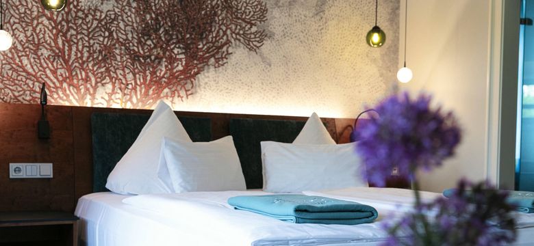 Bett im Doppelzimmer Favia in NeptunsReich