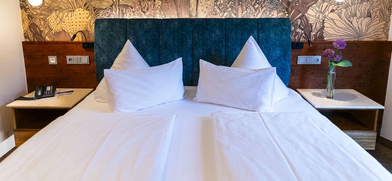 Doppelbett im Doppelzimmer Deluxe Marigold